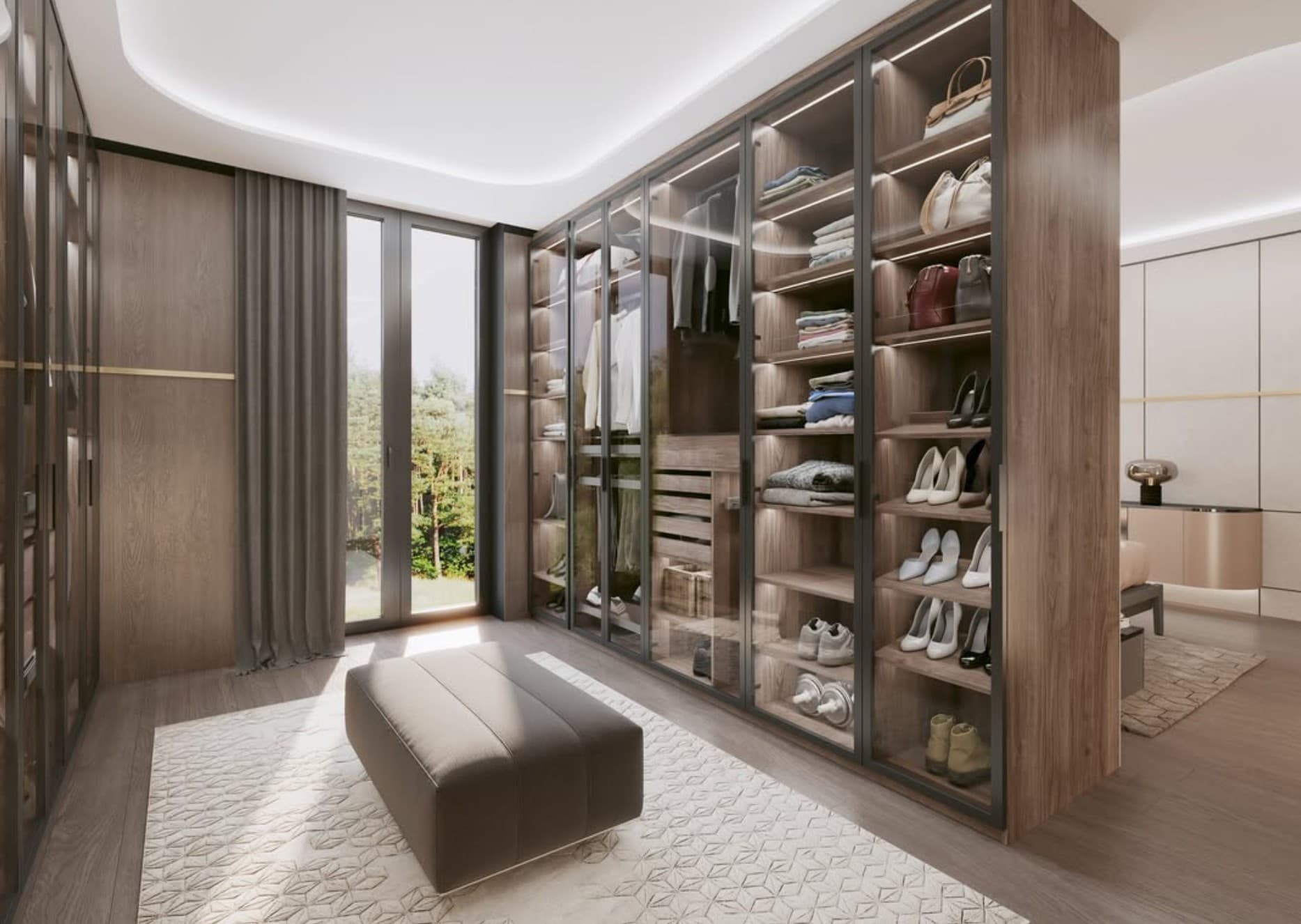 Walk-in closet with glass wardrobe doors in dark aluminum frames