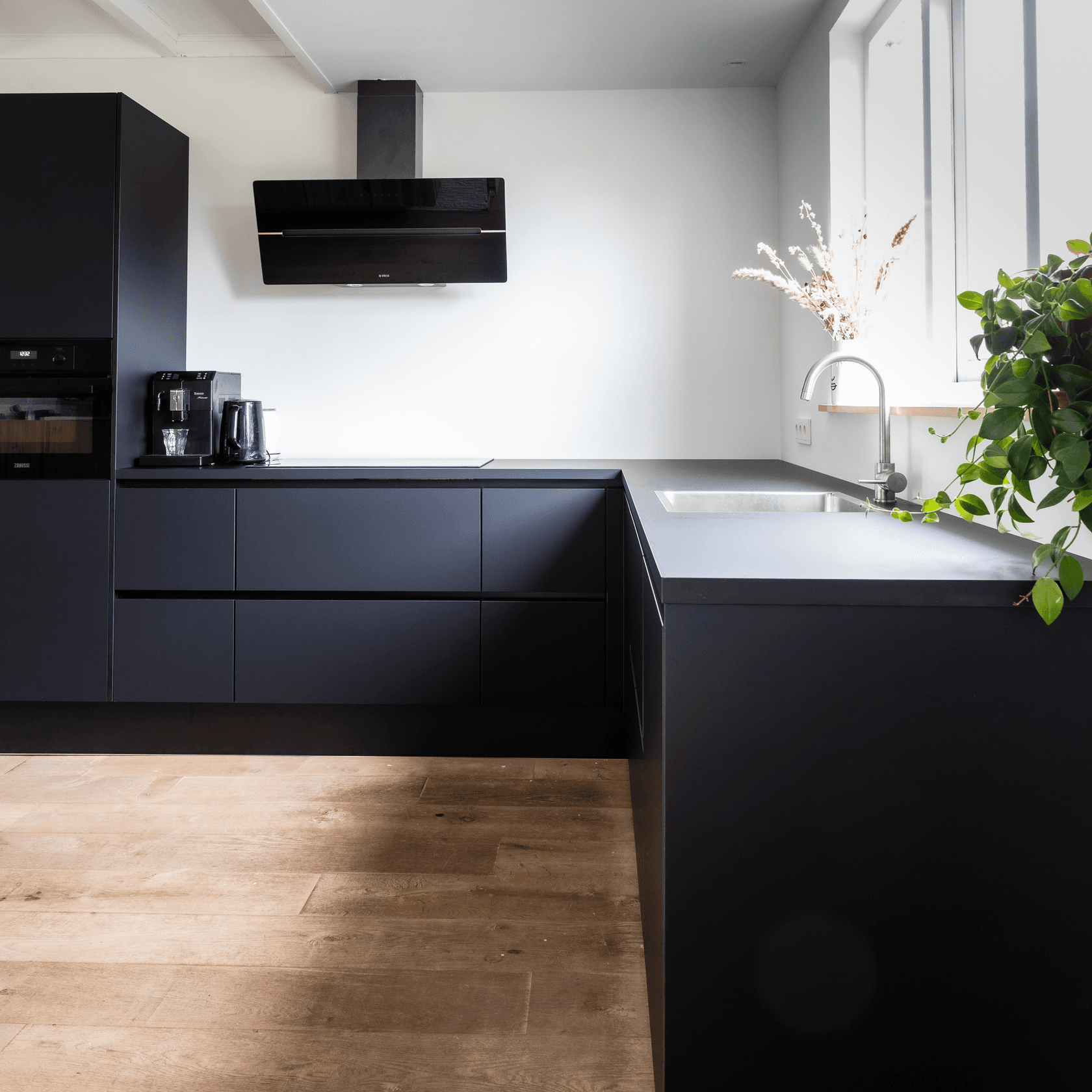 Matte black custom kitchen built by Cabinets Atelier