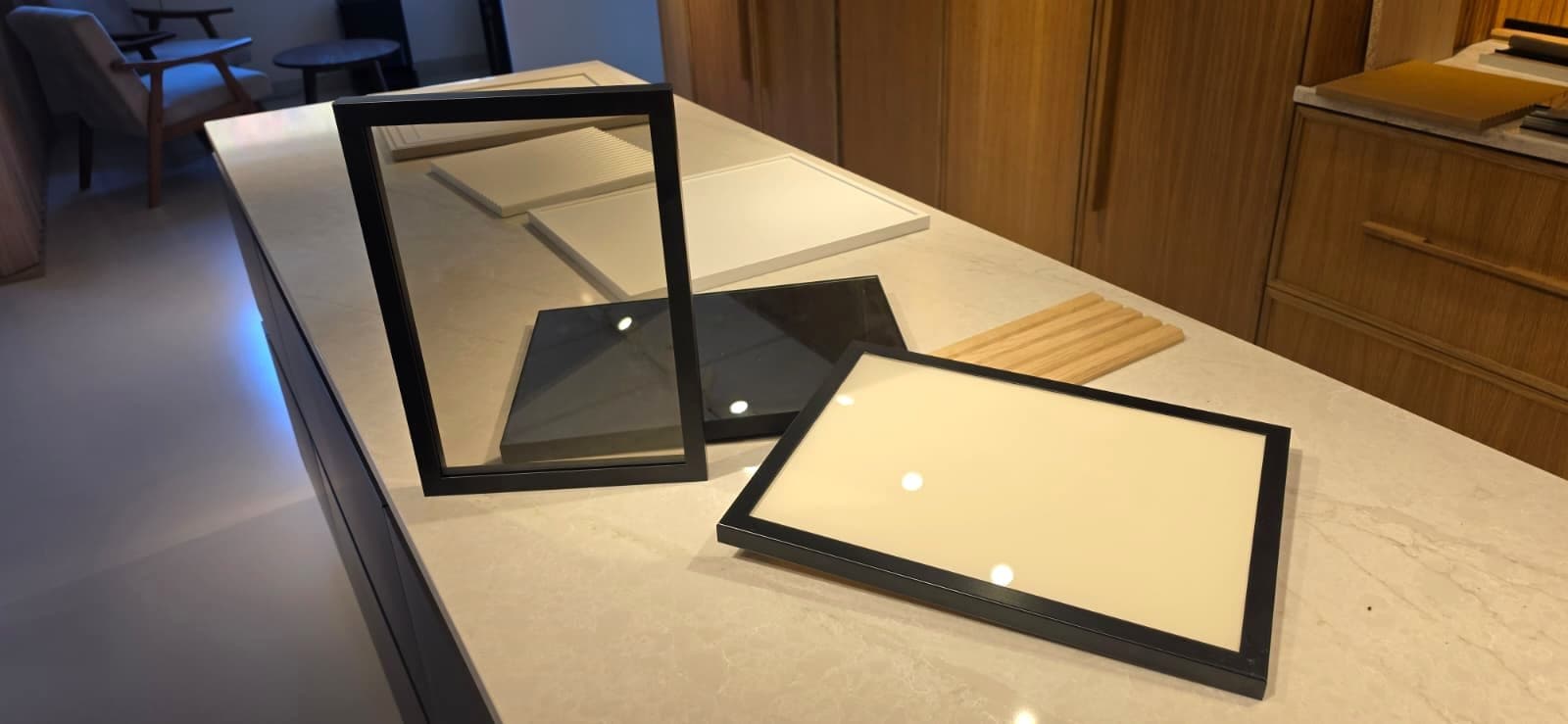 Aluminum frame door samples with smoked glass and panel fills in the showroom